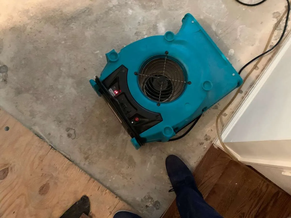 Air mover drying subfloor during Commercial Water Damage Restoration in Horizon City